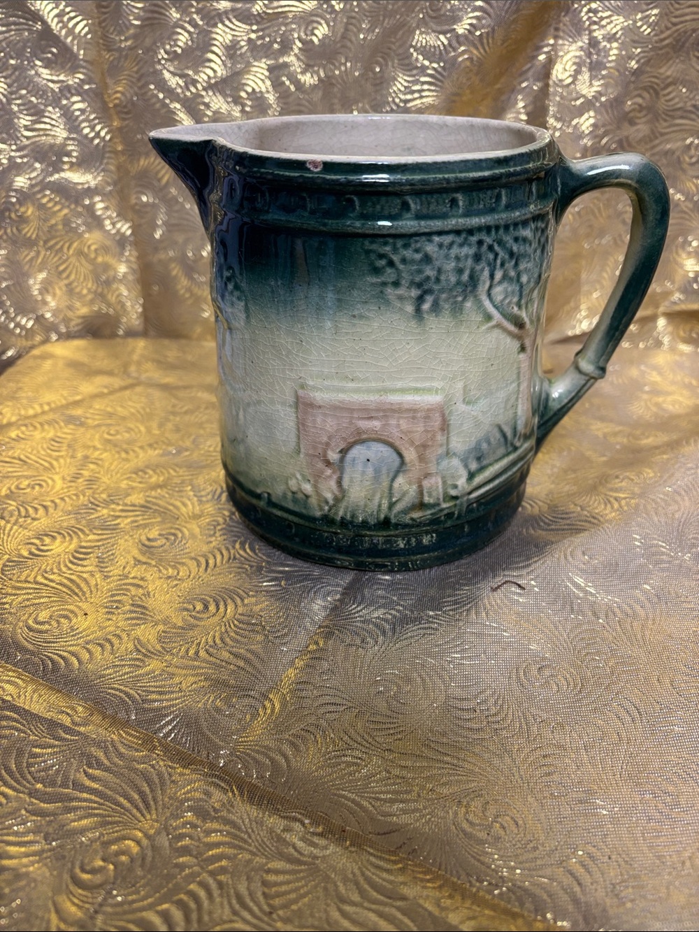 Green Glazed Scenic Relief Ceramic Pitcher with Handle